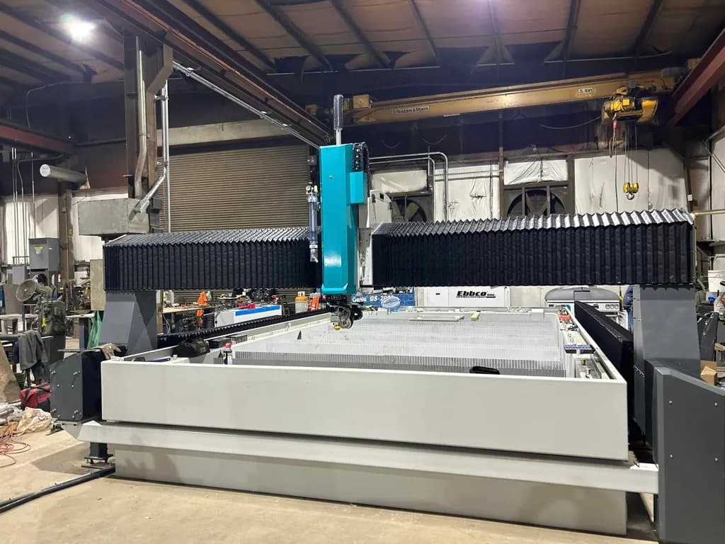 Large-format waterjet cutting machine on the St. Louis Water Jet shop floor